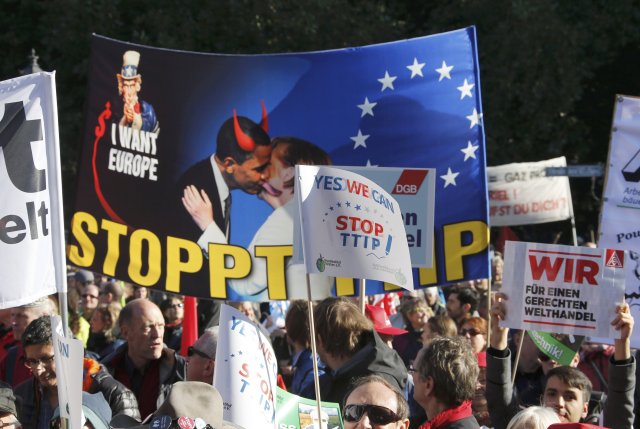 Consumer rights activists take part in a march to protest against the Transatlantic Trade and Investment Partnership (TTIP), mass husbandry and genetic engineering, in Berlin, Germany, October 10, 2015 Consumer rights activists take part in a march to protest against the Transatlantic Trade and Investment Partnership (TTIP), mass husbandry and genetic engineering, in Berlin, Germany, October 10, 2015